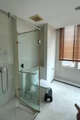 a bathroom with a toilet and a glass shower at Room near Iconsiam 2km in Bangkok