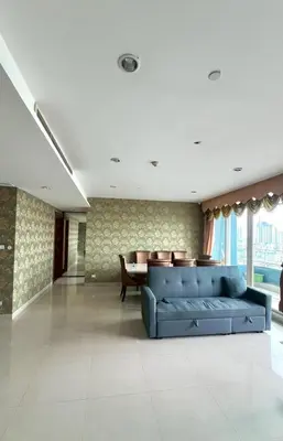 a living room with a blue couch and a table at Room near Iconsiam 2km in Bangkok