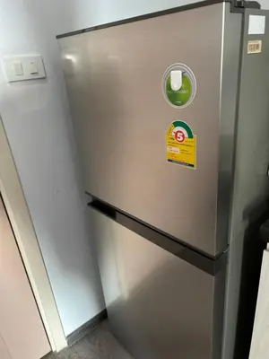 a stainless steel refrigerator with a sticker on it at 1BR Free pool&gym fast WIFI Airport Link in Sathani Ban Hua Mak