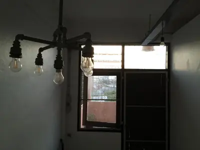 a room with a window with lights on the wall at 42 Guest House in Bangkok