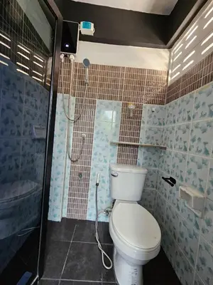 a bathroom with a toilet and a shower at Irich Residence Theparak S407 Bts-Chang Erawan 2kms in Ban Khlong Hua Sakae