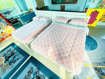 a couple of beds sitting in a room at Setthisin Art Boutique House,Iconsiam,BTS Thonburi in Godown