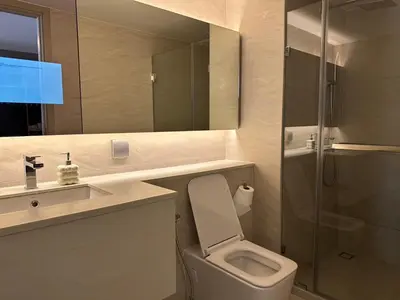 a bathroom with a toilet and a sink and a shower at Standardized at City View Condo near BTS Ratchathewi in Bangkok