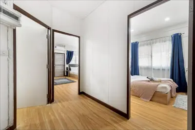 a large mirror in a room with a bedroom at GM7 - Private House Downtown 2mins walk to metro in Bangkok