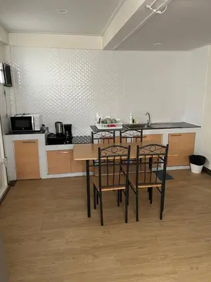 a kitchen with a table and chairs in a room at GM7 - Private House Downtown 2mins walk to metro in Bangkok