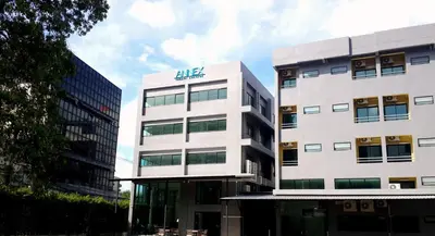 a large white building with an algas sign on it at Annex Lumpini Bangkok in Bangkok