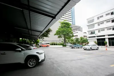 a parking lot with cars parked in a building at Annex Lumpini Bangkok in Bangkok