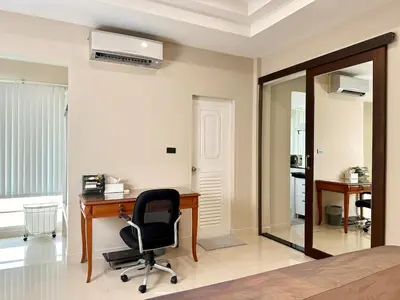 a bedroom with a desk and a chair at 2 mins to SRT I Urban Hideaway near Park in Bangkok