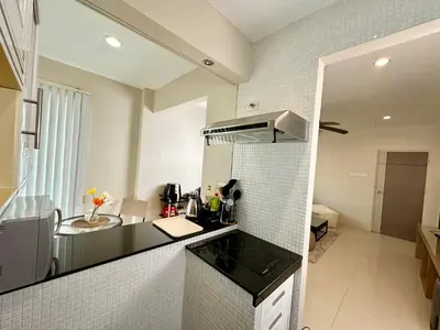 a kitchen with a sink and a counter top at 2 mins to SRT I Urban Hideaway near Park in Bangkok