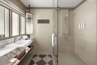 a bathroom with a sink and a shower at Courtyard by Marriott Bangkok Sukhumvit 20 in Bangkok