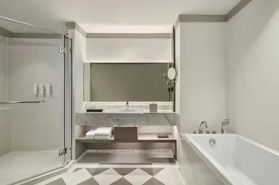 a bathroom with a sink and a shower at Courtyard by Marriott Bangkok Sukhumvit 20 in Bangkok
