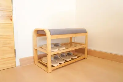 a shelf with shoes on it in a room at Buddy House in Chinatown - Private Rooms Walk to MRT in Bangkok