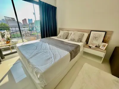 a bedroom with a large bed and a large window at Cozy stay! Near Chatuchak Market 814 in Bangkok
