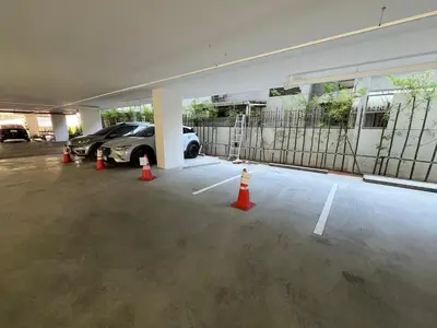 a parking garage with a car parked in it at Cozy Stay! Near Chatuchak Market 816 in Bangkok