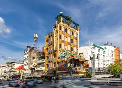 a tall building is being constructed on a city street at Diamond House Khaosan in Bangkok