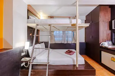 a bedroom with two bunk beds in a room at Diamond House Khaosan in Bangkok