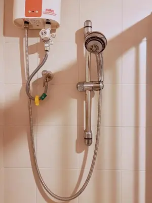 a shower in a bathroom with a shower head at 55sqm Hispeed LAN WiFi workplace 24h maxvalu in Bangkok