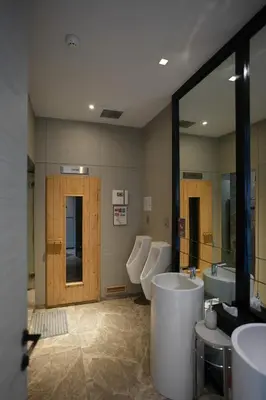 a bathroom with three sinks and a tub and a mirror at Life Ladprao 2 bedrooms condo in Bangkok