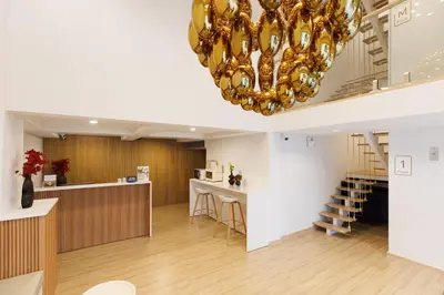 a large room with a chandelier in the middle at Takka Hotel - Bearing in Bangna
