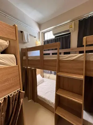 a room with two bunk beds in it at smoking buddy house in Bangkok
