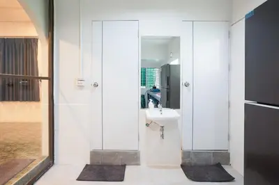 a bathroom with a sink and a mirror at Number 8 Poolvilla Bangkok in Sathani Ban Hua Mak