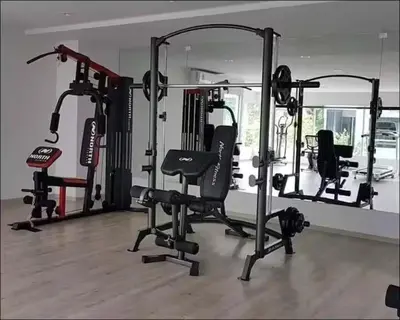 a gym with several tread machines in a room at Stunning Condo - BTS On Nut - Pool, Gym, Wi-Fi in Bangkok