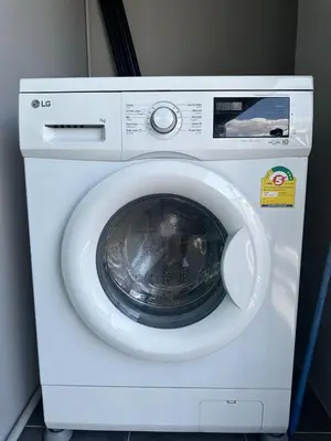 a white washing machine with its door open at Chill Condo near Icon Siam in Bangkok