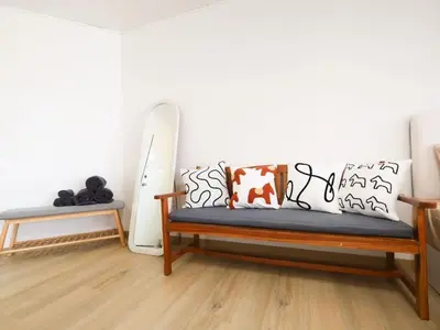 a room with a bench and a white wall at 3 Beds,WiFi,Washing Machine,IMPACT Arena at T9 in Ban Bang Phang