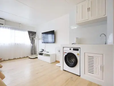 a kitchen with a washing machine in a white room at 3 Beds,WiFi,Washing Machine,IMPACT Arena at T9 in Ban Bang Phang