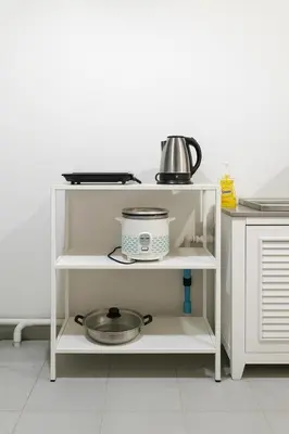 a white shelf with a pot on top of it at GM5 - Cozy Apartment 8pax, Ladprao, MRT&BTS in Bangkok