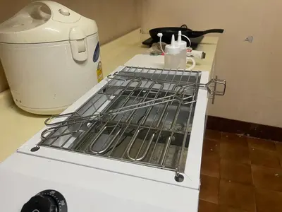a white stove top oven sitting on a counter at Home Rama 4 near BTS Thong Lor in Khlong Toei