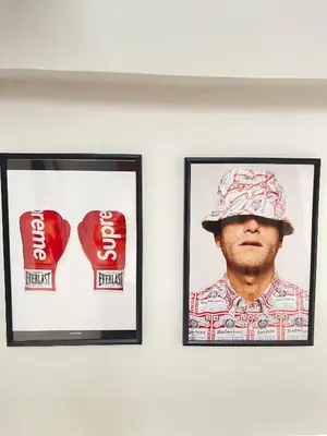 two framed pictures of a man with a hat on a wall at Nueng Rana 113 Unique House in Chinatown 3BR 2BA - Villa in Samphanthawong