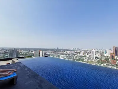 a pool on top of a building with a city at \u7d20\u5764\u9038\u6cbf\u7ebfBTS Ekkama Station in Bangkok