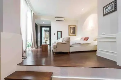a living room with a couch and a bed at Luxury Modern Pool Jacuzzi Villa 5BR Thonglor in Khlong Toei