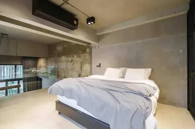 a bedroom with a large bed and a flat screen tv at Luxury Modern Pool Jacuzzi Villa 5BR Thonglor in Khlong Toei