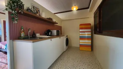 a kitchen with a sink and a washing machine at Best River view, Retro vibe studio apartment - Bangkok Old Town in Bangkok