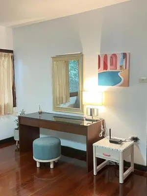 a desk with a mirror and a chair in a room at AT ASok Vintage House Near BTS Asok MRT Sukhumvit in Khlong Toei
