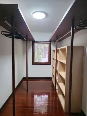an empty room with shelves and a window at AT ASok Vintage House Near BTS Asok MRT Sukhumvit in Khlong Toei