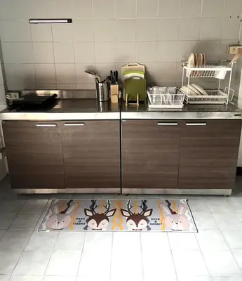 a kitchen with a counter with animals on the floor at AT ASok Vintage House Near BTS Asok MRT Sukhumvit in Khlong Toei