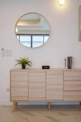 a dressing room with a mirror and a dresser at Ayas Retreat - Muji Ekkamai Pool Villa with 4 bedrooms in Khlong Toei