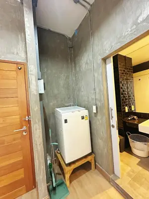 a kitchen with a small refrigerator in a room at 260m walk to BTS Prakanong in Bangkok