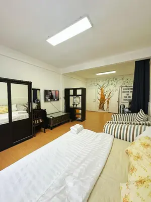 a large room with a bed and a couch at Top Location! 800m MRT Rama9 in Bangkok
