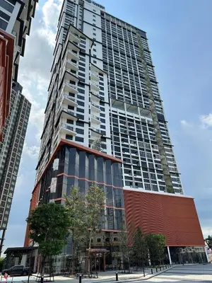 a tall building with a red building at Rama9 Loft Life in Bangkok