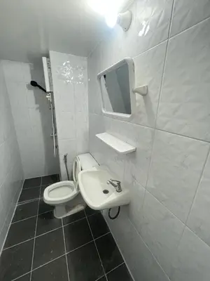 a bathroom with a toilet and a sink and a mirror at ห้องเช่ารายวัน เมืองทองธานี C5 By ณดา in Ban Bang Phang