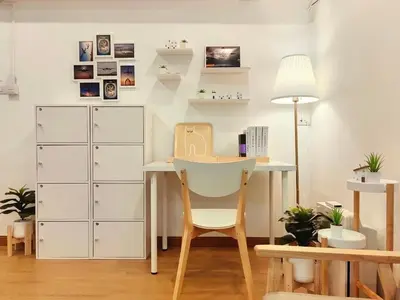 a room with a desk and a table with a chair at Secret Muji Vintage Building ห้องลับมูจิในตึกวินเทจ in Ban Song Hong