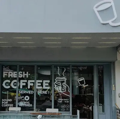 a coffee shop with a sign on the front of it at Stylish Studio in Prime Sukhumvit-Next to BTS Nana in Bangkok
