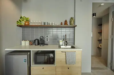 a kitchen with a sink and a counter top at Stylish Studio in Prime Sukhumvit-Next to BTS Nana in Bangkok