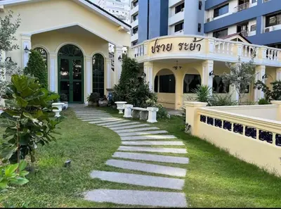 a building with a walkway in front of a building at Spacious duplex 2 BR apartment max 6 guests - 3 min walk to BTS Nana in Bangkok