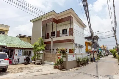 a house on the corner of a street at 94Home Donmuang in Bang Khen