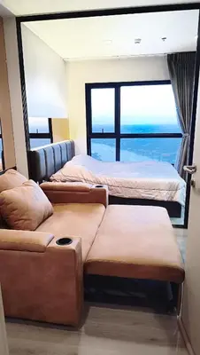 a room with three beds and a view of the ocean at Luxury Riverside Condo, 3 SKY Pools , Close to MRT Train Station in Ban Sai Ma